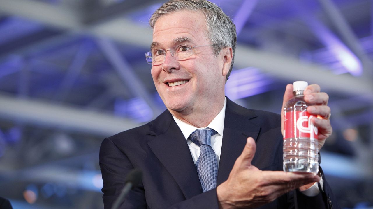 Bush poses with CNN-labeled water in the hours before the event.