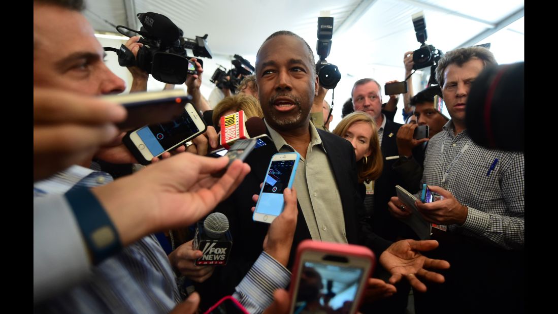 Carson answers reporters' questions before the debate.
