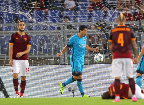 Barcelona forward Luis Suarez celebrates after opening the scoring at Roma -- but his effort was soon to be overshadowed