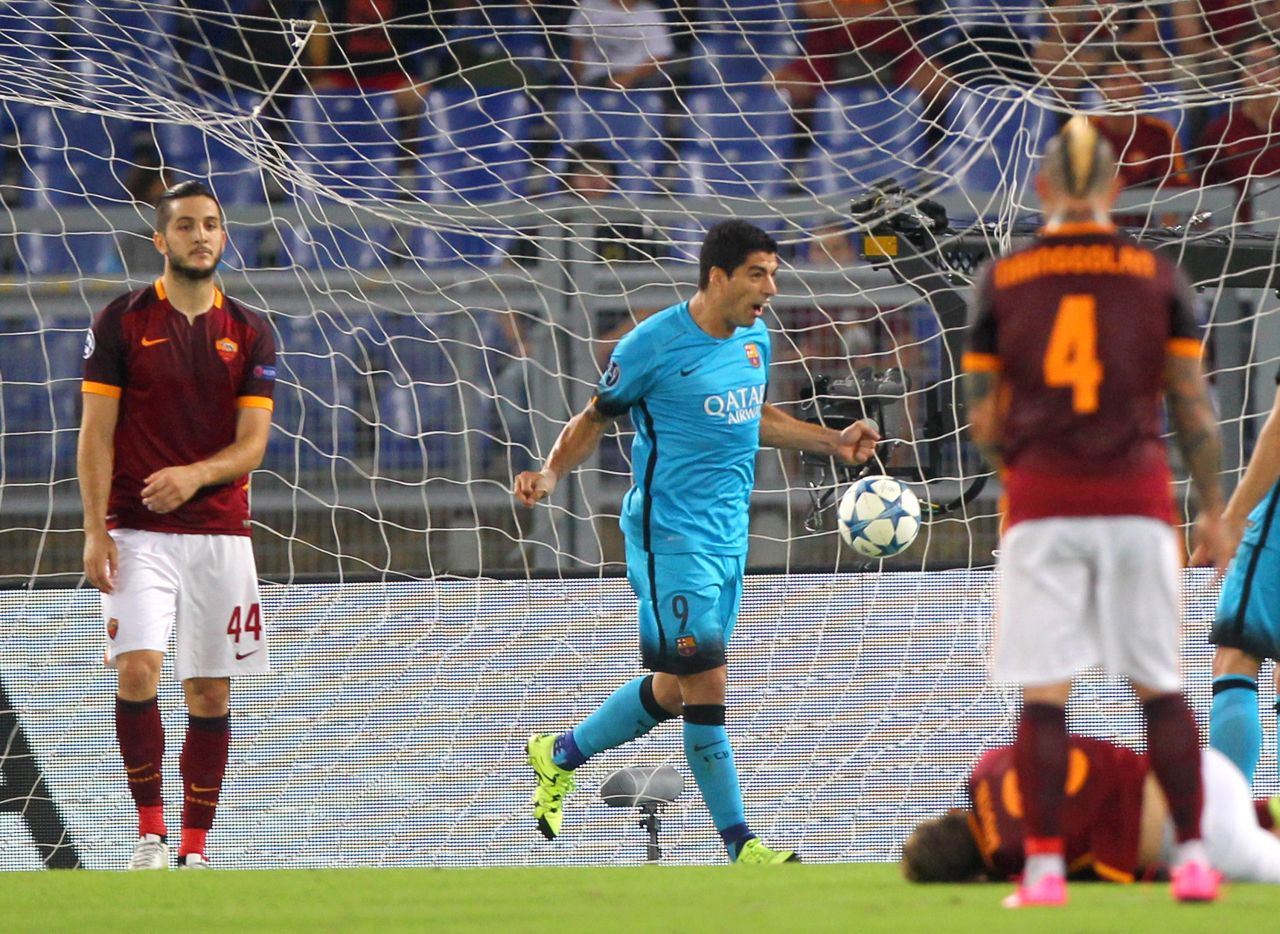Barcelona forward Luis Suarez celebrates after opening the scoring at Roma -- but his effort was soon to be overshadowed