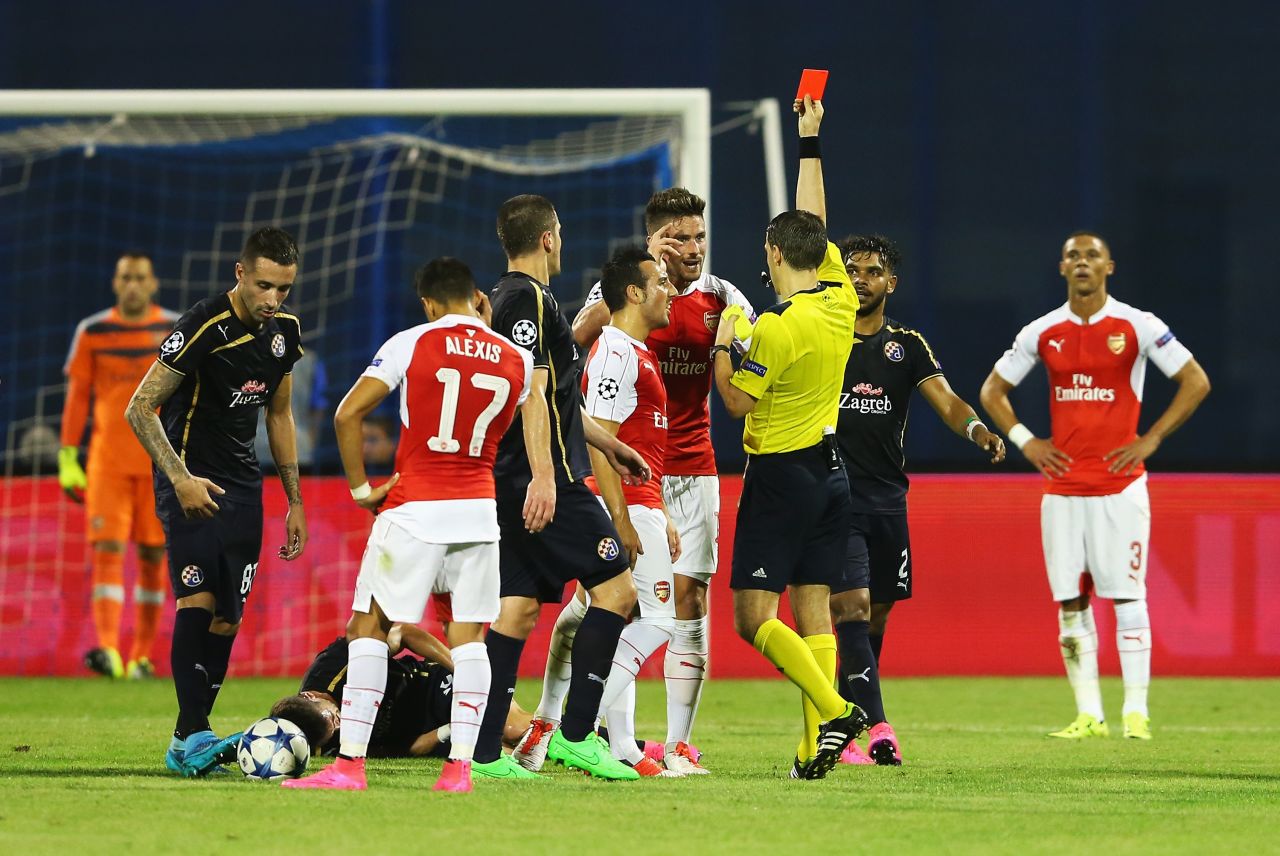 Arsenal striker Olivier Giroud is shown the red card by referee Ovidiu Hategan at Dinamo Zagreb as the London club slumped to defeat.