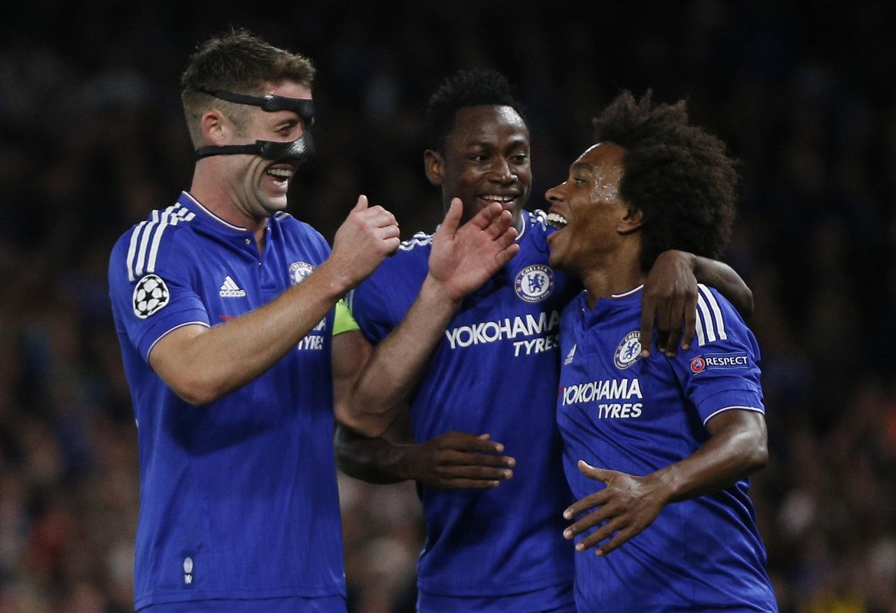 Colleagues congratulate Chelsea's Brazilian midfielder Willian (right) after his free-kick sailed through the Maccabi Tel Aviv defense to open the scoring at Stamford Bridge.
