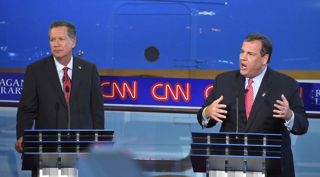 Christie delivers an answer as Kasich looks on.