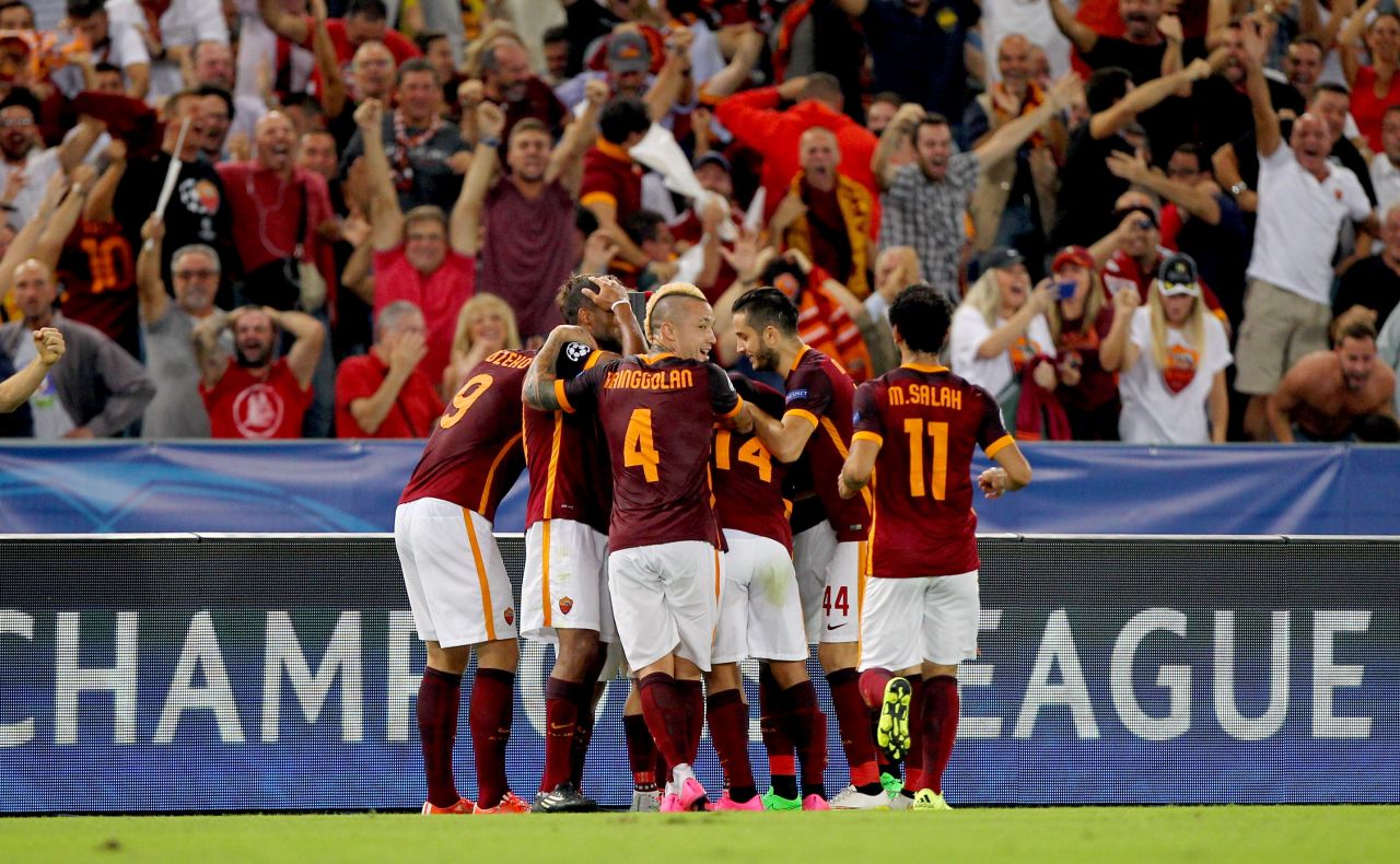 Roma players and fans celebrate the spectacular Florenzi goal, from almost 60 yards out wide on the right, that leveled against Barca.