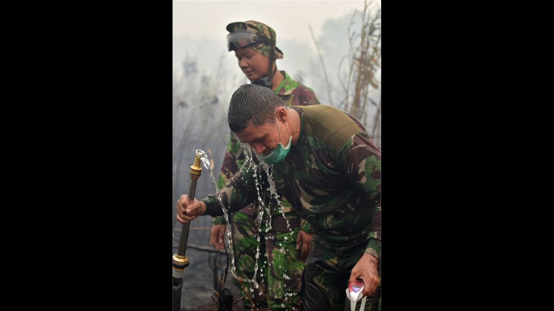 A firefighter washes his face in Kampar, Indonesia, on September 12. 