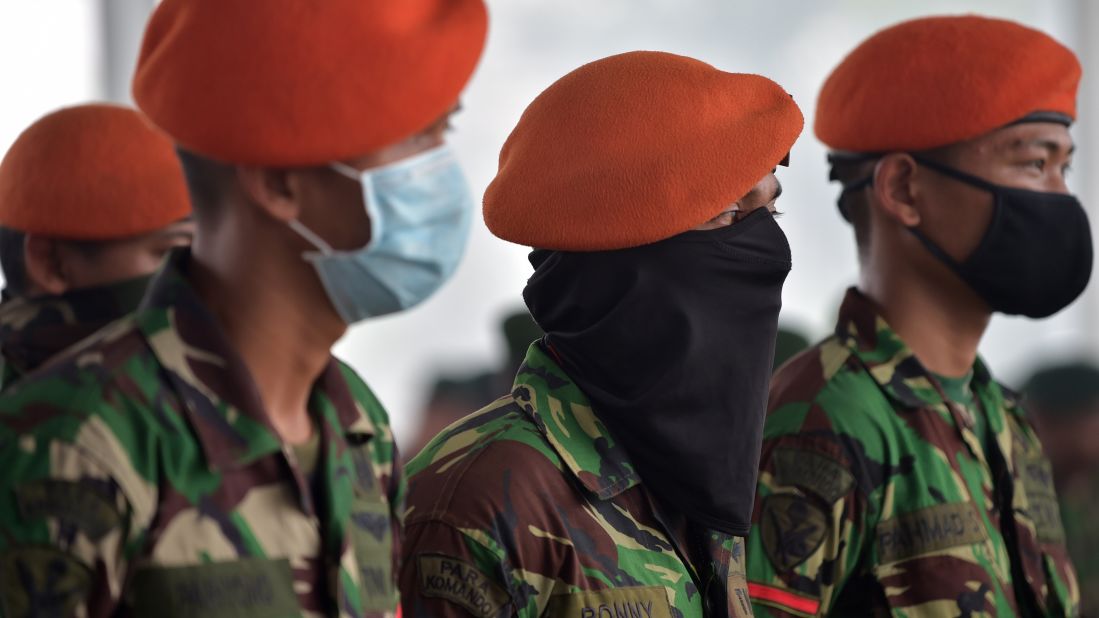 Members of the Indonesian Air Force attend a roll call at an airport before reinforcing firefighters in Pekanbaru, Indonesia, on Tuesday, September 15. 