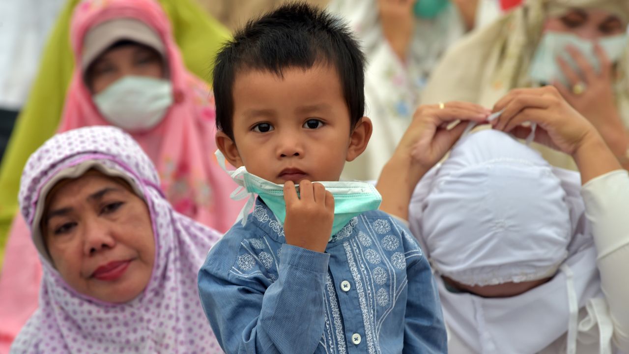 People in Pekanbaru wear masks during prayers on September 15.