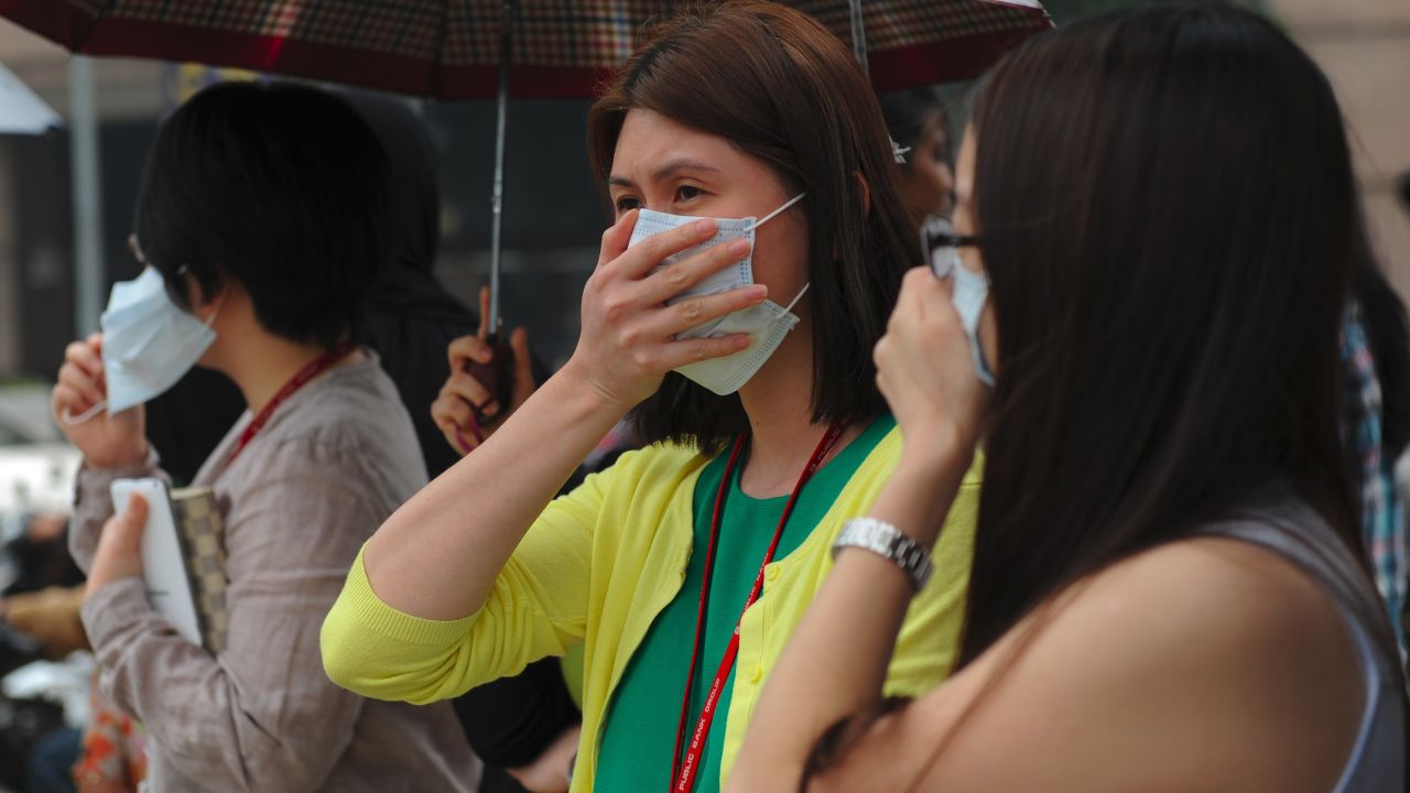 Pedestrians wear face masks in Kuala Lumpur on September 11.