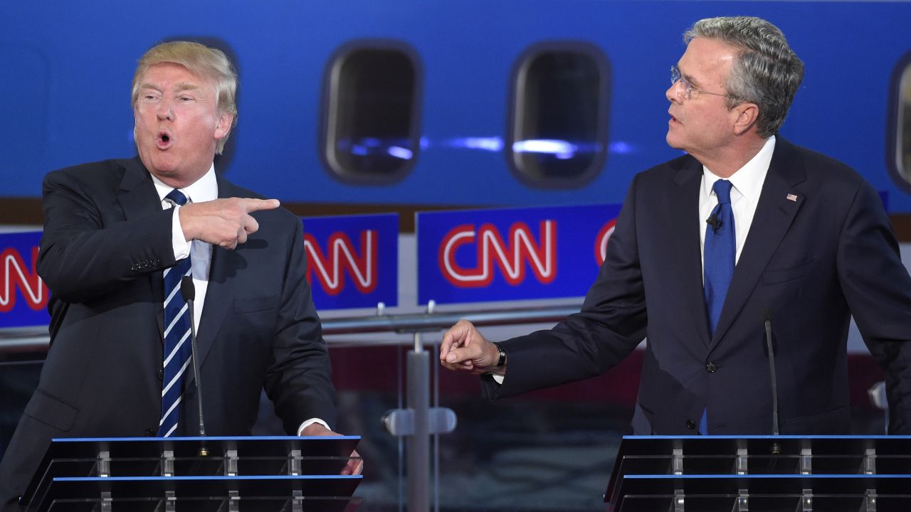 Republican presidential candidates, former Florida Gov. Jeb Bush, right, and Donald Trump both speak during the CNN Republican presidential debate at the Ronald Reagan Presidential Library and Museum on Wednesday, Sept. 16, 2015, in Simi Valley, Calif. (AP Photo/Mark J. Terrill)