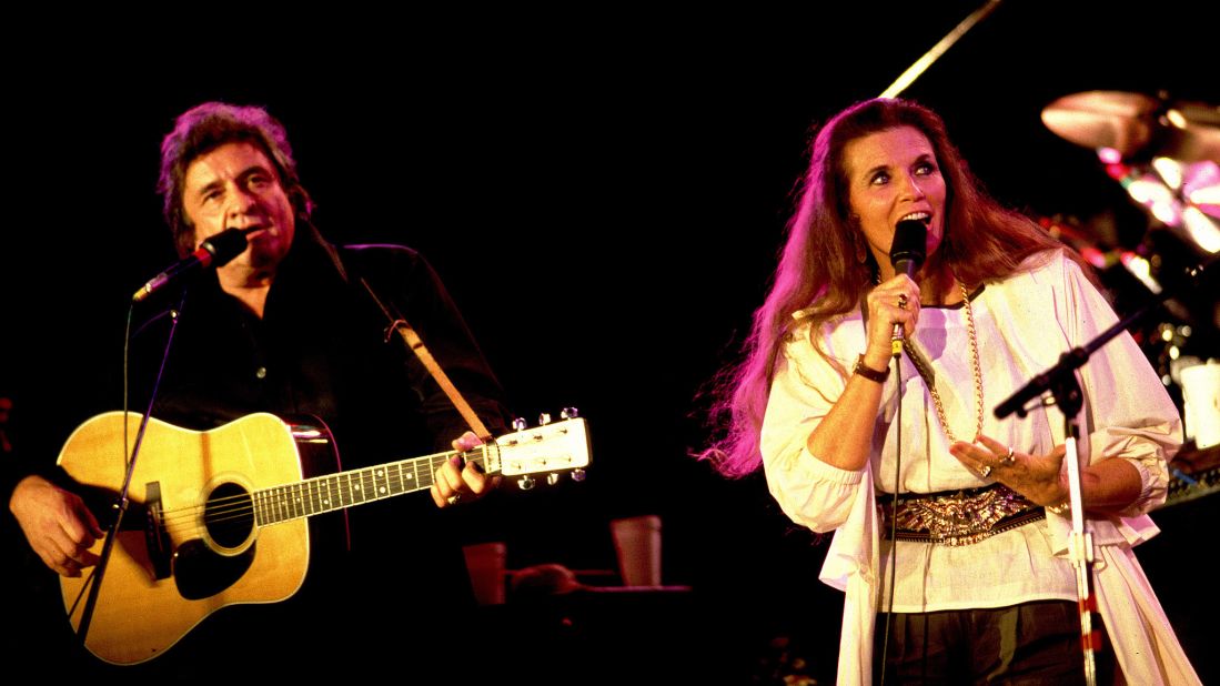 Johnny Cash and wife June Carter perform at Farm Aid in 1985. Cash was flying high at the time, thanks to the No. 1 country song "Highwayman," which he recorded with Wilson, Waylon Jennings and Kris Kristofferson. It would be his last chart-topper.