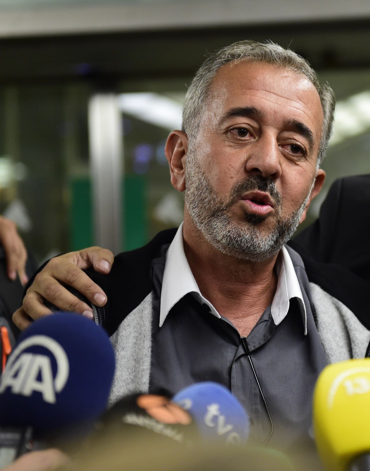 Osamsa Abdul Mohsen addresses the media at Atocha train station, Madrid. The Spanish footballing school CENAFE offered the Syrian a coaching role and a home for his family.