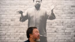Chinese artist Ai Weiwei poses for photographers during a press preview at the Royal Academy in London on September 15, 2015, ahead of the opening of a major exhibition of his work. The exhibition runs from September 19 to December 13, 2015.   AFP PHOTO / LEON NEAL        (Photo credit should read LEON NEAL/AFP/Getty Images)