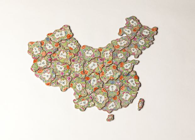 <em>Free Speech Puzzle</em>, 2014. 32 pieces of hand-painted porcelain in the Qing dynasty imperial style. The porcelain depicts China from replicas of traditional pendants which would depict a family's name and status. 