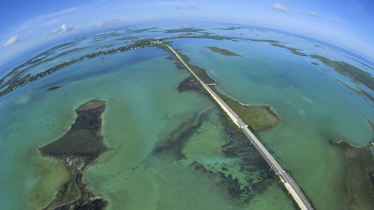 Completed in 1912, Florida's Overseas Highway bisects the Atlantic Ocean to the east (left), and the Gulf of Mexico to the west (right). 