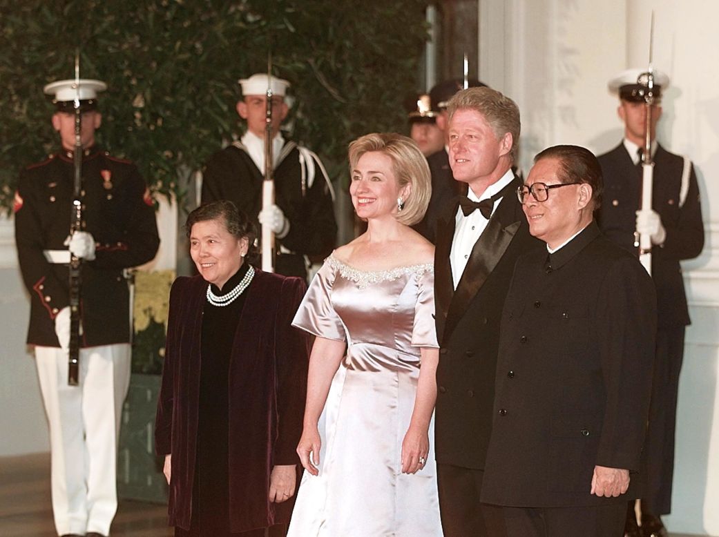 U.S. President Bill Clinton and First Lady Hillary Clinton welcome former Chinese President Jiang Zemin and his wife Wang Yeping at a White House state dinner in Jiang's honor on October 29, 1997. During his visit to the U.S., Putting aside their differences on human rights and democratic reform, Clinton and Jiang announced a pact aimed at halting the spread of nuclear weapons and giving China access to U.S. nuclear power plant technology.