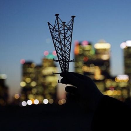 "A photographer named Chris Tubbs documents each of my projects. He took this photo when we were on the Greenwich Peninsula while I explained the concept for my next sculpture with a small railway model."