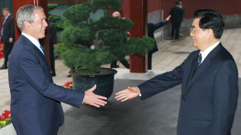 Former Chinese President Hu Jintao greets then-US President George W. Bush on August 10, 2008 in Beijing, China. 
