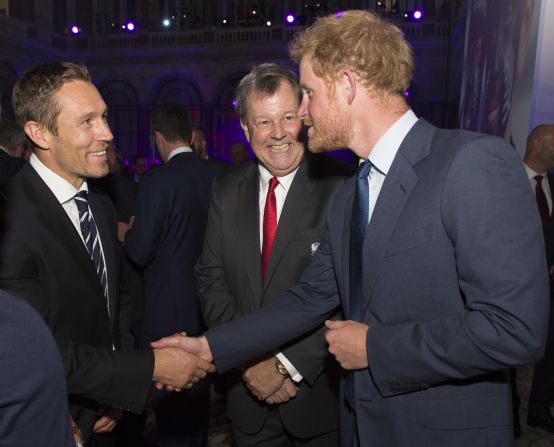 Jonny Wilkinson (left), who kicked England to World Cup final glory in 2003, shares a joke with Prince Harry. 