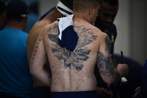 Australian flanker Sean McMahon shows off his tattoos at the University of Bath.