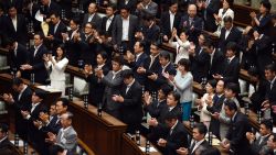 Councillors of the upper house applaud after the security bill passed the parliament on early September 19, 2015. The bill would allow troops to fight on foreign soil for the first time since World War II, despite fierce criticism it will fundamentally alter the character of the pacifist nation.        AFP PHOTO / TOSHIFUMI KITAMURA        (Photo credit should read TOSHIFUMI KITAMURA/AFP/Getty Images)