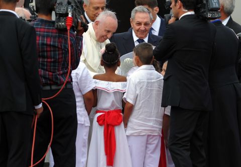 Children welcome the Pope shortly after he landed at the airport on September 19. 