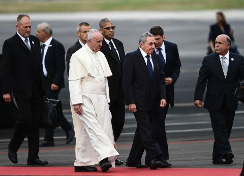Cuban President Raul Castro walks with the Pope after his arrival on September 19. 