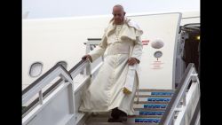 Pope Francis' cap flies off his head as he deplanes in Havana, Cuba, Saturday, Sept. 19, 2015. The pope began his 10-day trip to Cuba and the United States, embarking on his first trip to the onetime Cold War foes after helping to nudge forward their historic rapprochement. (AP Photo/Ismael Francisco, Cubadebate Via AP)