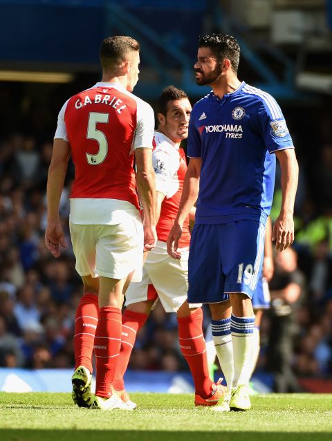 Arsenal defender Gabriel Paulista squares off with Chelsea striker Diego Costa.