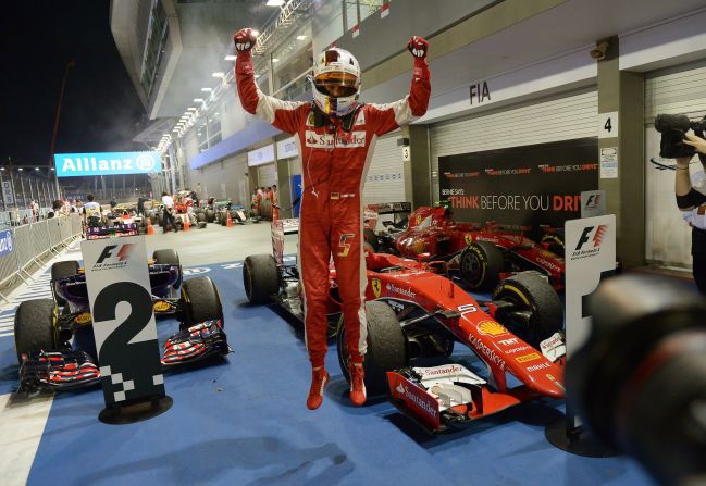 Ferrari's Sebastian Vettel jumps for joy after claiming his 42nd career F1 victory in Singapore.