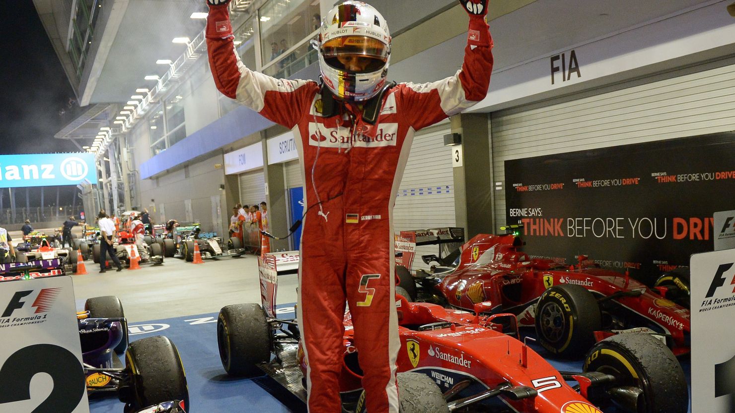 Ferrari's Sebastian Vettel jumps for joy after claiming his 42nd career F1 victory in Singapore. 