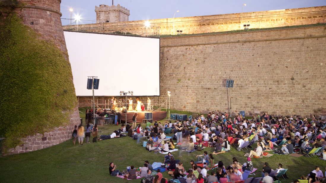 Though this 17th century fortress has a dark past, <a href="http://www.venuereport.com/roundups/22-incredible-outdoor-cinemas-worldwide/entry/7/" target="_blank" target="_blank">Sala Montjuic</a> is one of the most successful examples of a castle that's been reclaimed for public use. Guests can bring picnic blankets and dinner as they take in both the screen and the sunset every Wednesday night. 