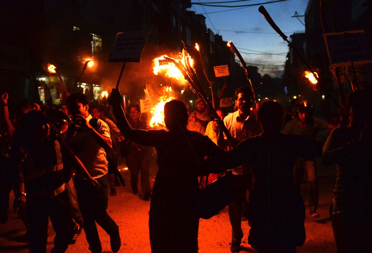 Nepalese activists from marginalised Tharu community take part in a torch rally against the division of Tharu-majority districts in the country's proposed federal structure in Kathmandu on August 11, 2015. 