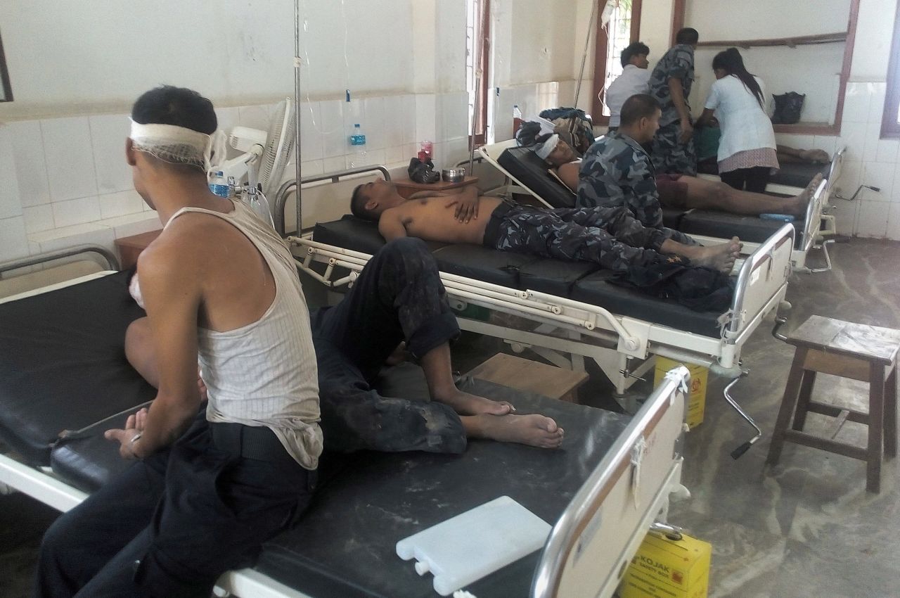 Nepalese law enforcement officers, who were injured in a deadly clash with protestors, receive treatment at Tikapur Hospital in Kailali District, some 420 kms west of capital Kathmandu on August 24, 2015.  