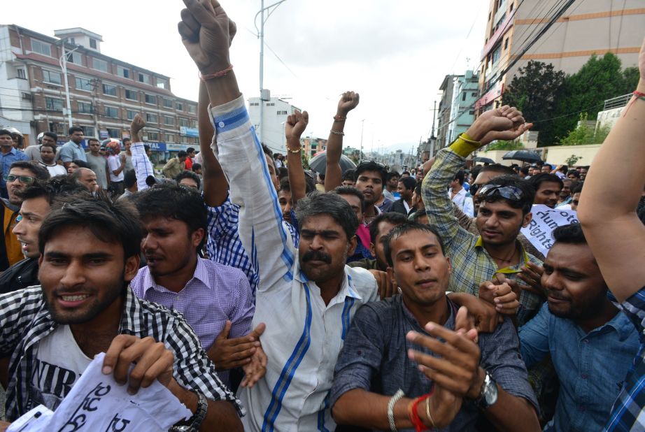 Nepalese activists of the Madhesi group chant slogans against the proposed constitution at near parliament in Kathmandu on September 19, 2015. The new constitution, endorsed in parliament, is the first to be drawn up by elected representatives of Nepal's people after centuries of autocratic rule. It is the final stage in a peace process that began when the Maoists laid down their arms in 2006 after a decade-long civil war with state forces and turned to politics, winning parliamentary elections two years later and abolishing the monarchy.  