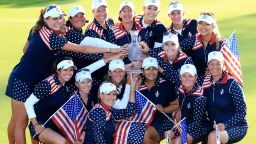 The victorious United States team celebrates with the Solheim Cup after a stunning comeback on the final day in Germany.