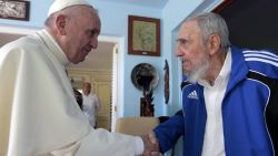 Pope Francis and Cuba's Fidel Castro shake hands, in Havana, Cuba, Sunday, Sept. 20, 2015. The Vatican described the 40-minute meeting at Castro's residence as informal and familial, with an exchange of books. (AP Photo/Alex Castro)