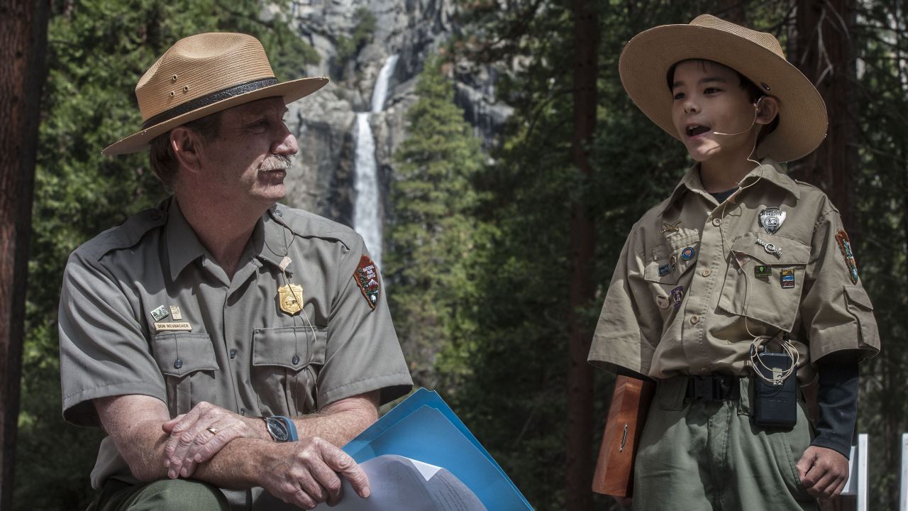 Yosemite National Park Superintendent Don Neubacher, left, spoke with Honorary Yosemite National Park Ranger Gabriel Lavan-Ying during the March kickoff ceremony to celebrate the 125th anniversary of Yosemite National Park. Gabriel is the honorary chairman of this year's celebrations. His wish, granted by the Make-A-Wish foundation and Yosemite officials, was to become a ranger. 