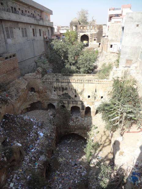 I always show this baoli, or stepwell, as an example and reminder of how a unique, awe-inspiring, formerly essential monument can be reduced to rubble. I had to climb on a roof to even see the extent of this marvel, one of the largest I've encountered, and which must have been an incredible sight hundreds of years ago. Now it's surrounded by buildings, used as a dump, and no-one has any idea it's there. It made me cry."