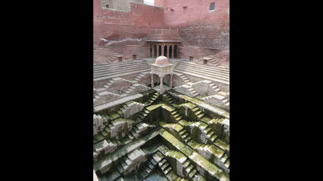 "This is another example of a kund, small but powerfully sculptural. The gradation of hues from pink to white to green (from algae) makes it one of the most colorful of all the stepwells I've visited, and it's a particular favorite."