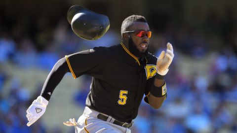 Pittsburgh's Josh Harrison loses his helmet as he runs to first base during a Major League Baseball game in Los Angeles on Sunday, September 20.