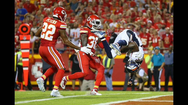 Denver Broncos wide receiver Emmanuel Sanders somersaults into the end zone during an NFL game in Kansas City, Missouri, on Thursday, September 17.
