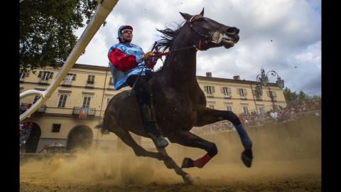 A horse and jockey take part in the Palio di Asti trials Saturday, September 19, in Asti, Italy. The Palio di Asti is the oldest bareback horse race in Italy. It has been run since the 13th century.