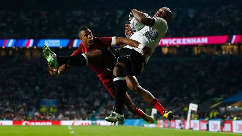 Fiji's Nemani Nadolo scores a try as he is pressured by England's Anthony Watson during a Rugby World Cup match in London on Friday, September 18. England won 35-11.