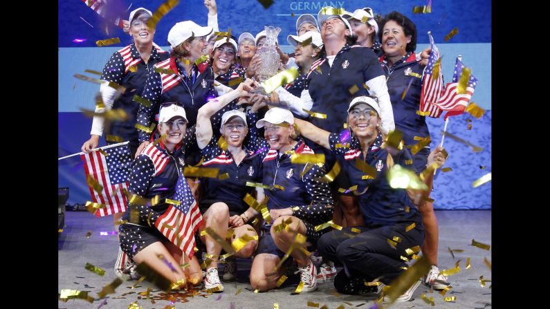 U.S. golfers celebrate with the Solheim Cup after defeating Europe's team Sunday, September 20, in St. Leon-Rot, Germany. The Americans trailed 10-6 going into the final singles matches, <a href="index.php?page=&url=http%3A%2F%2Fwww.cnn.com%2F2015%2F09%2F20%2Fgolf%2Fgolf-solheim-usa-wins-controversy%2Findex.html" target="_blank">but they rallied</a> to win by a single point.