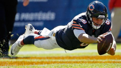 Chicago quarterback Jimmy Clausen dives to recover a fumble during a home game against Arizona on Sunday, September 20.