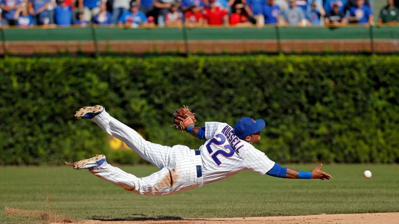 Chicago Cubs shortstop Addison Russell tosses the ball to second base to get the final out of the game Saturday, September 19, against St. Louis. <a href="index.php?page=&url=http%3A%2F%2Fm.mlb.com%2Fnews%2Farticle%2F150640306%2Faddison-russell-calls-diving-stop-great-moment" target="_blank" target="_blank">See video of the play here</a>