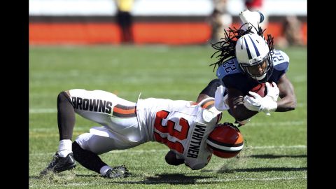 Tennessee Titans running back Dexter McCluster is tackled by Cleveland's Donte Whitner during an NFL game in Cleveland on Sunday, September 20. 