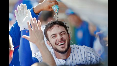 A teammate pours sunflower seeds on Kris Bryant after Bryant hit a home run for the Chicago Cubs on Saturday, September 19.