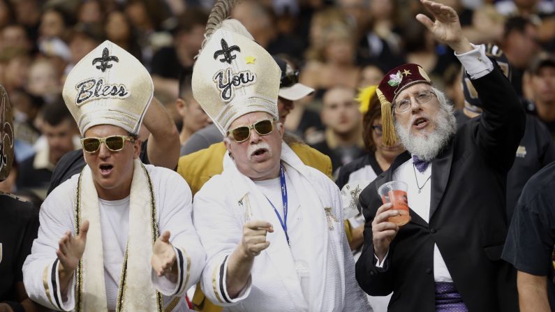 Fans of the NFL's New Orleans Saints cheer for their team during a game against Tampa Bay on Sunday, September 20.