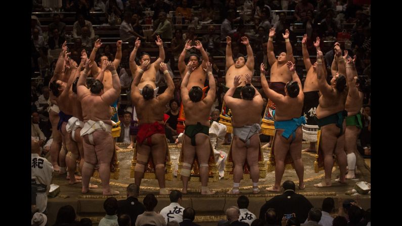 Wrestlers enter the ring during the Tokyo Grand Sumo tournament on Thursday, September 17. <a href="index.php?page=&url=http%3A%2F%2Fwww.cnn.com%2F2015%2F09%2F15%2Fsport%2Fgallery%2Fwhat-a-shot-sports-0915%2Findex.html" target="_blank">See 44 amazing sports photos from last week</a>